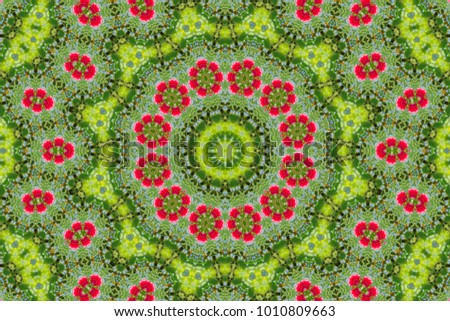 abstract background of floral pattern of a kaleidoscope. pink blue green background fractal mandala. abstract kaleidoscopic arabesque. geometrical ornament flower pattern