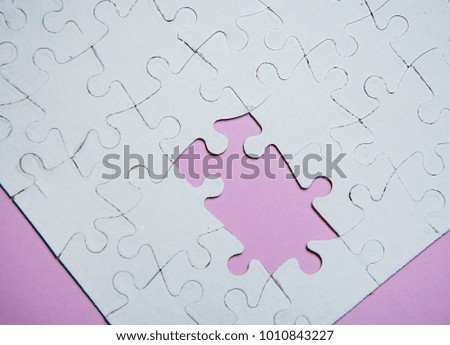 Empty white pieces of the puzzle are completed as a copy of the space. to collect puzzles. purple background color