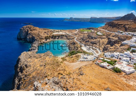 View of St. Paul´s bay, Lindos village and Mediterranean Sea from acropolis of Lindos (Rhodes, Greece)