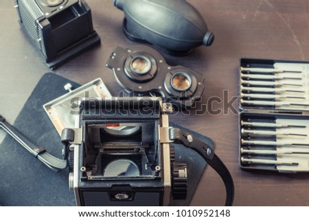 Vintage look of medium format camera cleaning.