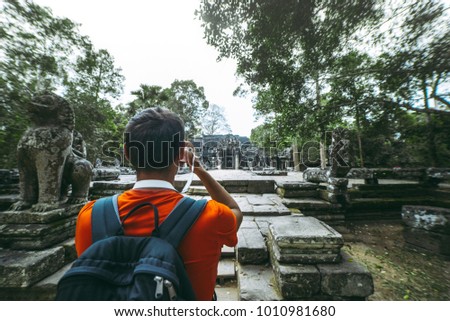 Man is shooting a picture of Bantey Kdei templ, Angkor, Cambodia
