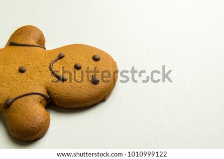 Home-Made Ginger Bread Man Cut In Half On A White Background