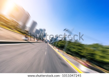 panoramic cityscape with empty road