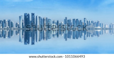 Futuristic urban skyline of Doha, Qatar. Doha is the capital and largest city of the Arab state of Qatar. Panoramic landscape of West bay Royalty-Free Stock Photo #1011066493