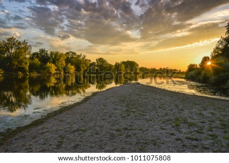 Loire river at sunset, colorful picture of the river loire with sun and clouds