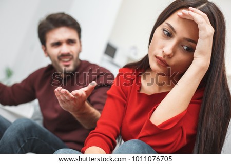 Young couple having romantic evening at home argument Royalty-Free Stock Photo #1011076705
