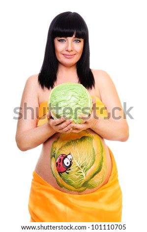 pregnant woman holding the cabbage in her hands. color picture on the abdomen. isolated on a white background