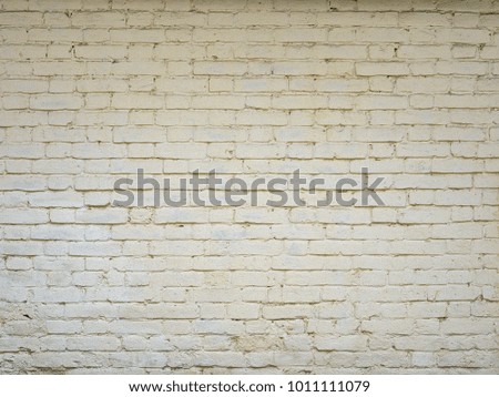 Fragment of a brick wall, brickwork in warm tones