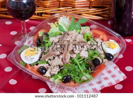 Fresh salad with tuna fish, anchovies and arugula