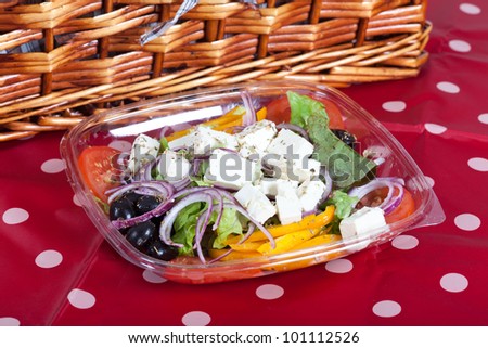Greek salad with Feta cheese, red onions, olives and yellow pepper