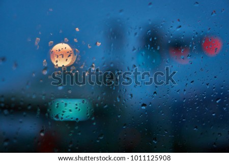 rainy day with road view through car window with rain drops,lonely background