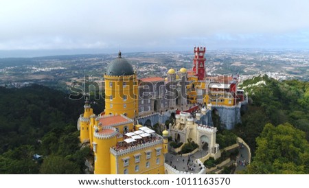Aerial photo of the iconic Pena National Palace moving towards building originally built on Monastery of Nossa Senhora da Pena and renovated extensively through initiative of Ferdinand II of Portugal