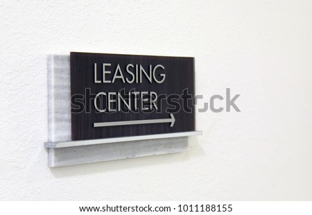 Leasing center sign on wall