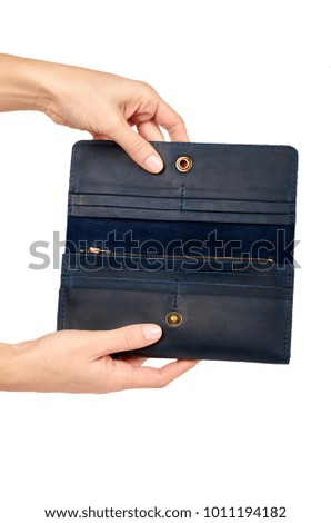 Blue leather wallet in hand isolated on white background