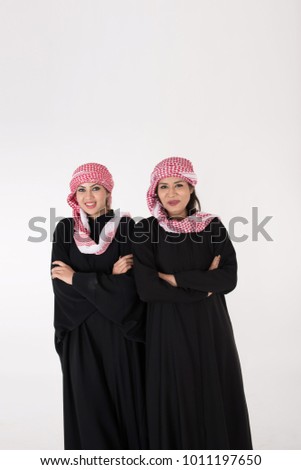 Tow Arabic Women in traditional dress on white background