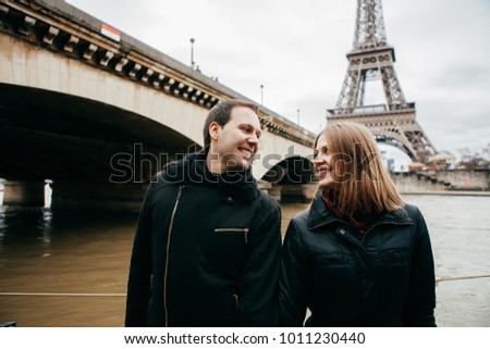 Beautiful couple on the background of the eiffel tower