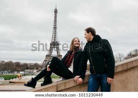 Beautiful couple on the background of the eiffel tower