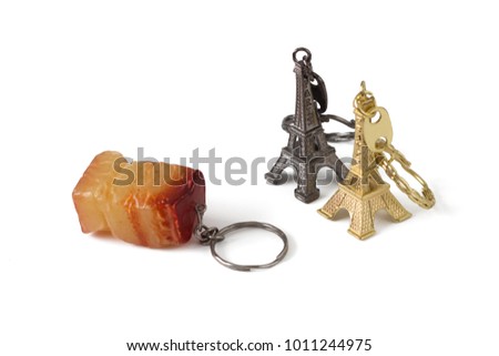 Souvenir-key chains from France and Ukraine. French key chains in the form of a eiffel tower, Ukrainian in the form of a piece of lard