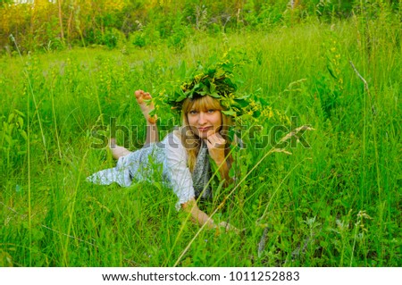 girl forest nymph lying in the grass