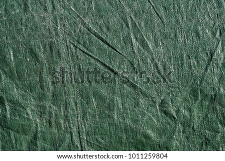 Green plastic woven fabric samples, texture background