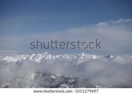 View above clouds on a mountain peak