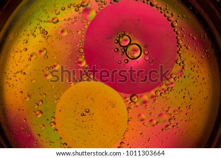 Abstract photo of oil water bubbles on colourful background. Macro image.