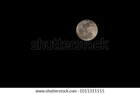 A full moon picture at a dark night, showing complete texture of the moon.