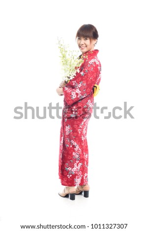 Charming asian woman wearing kimono with orchid flowers on white background.