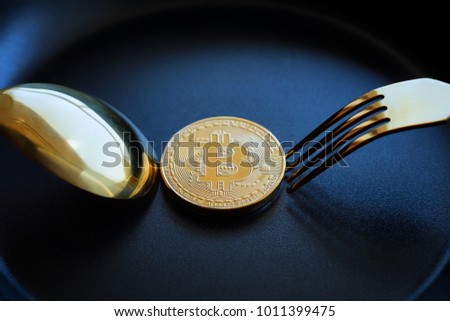 Everyone wants bitcoin, Digital currency physical gold bitcoins on dish with spoon, Crytocurrency Coin under the fork, Blockchain Transaction System Crisis Concept