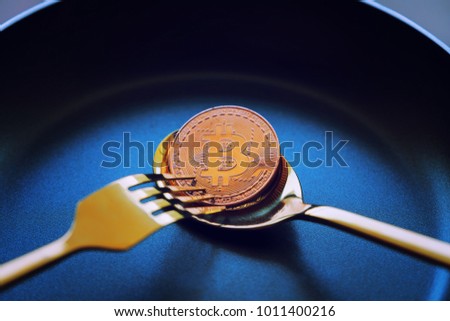 Everyone wants bitcoin, Digital currency physical gold bitcoins on dish, Crytocurrency Coin under the forkand spoon, Blockchain Transaction System Crisis Concept