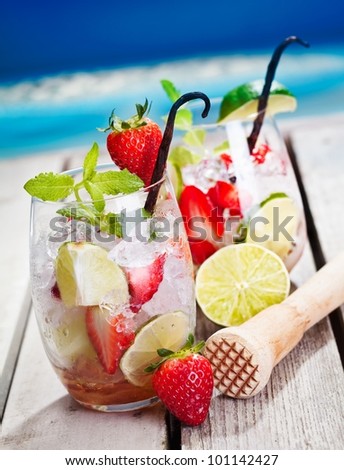 Mojito with Strawberries and limes. In Front of the beach.