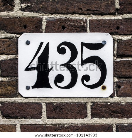 house number four hundred thirty-five on a brick wall