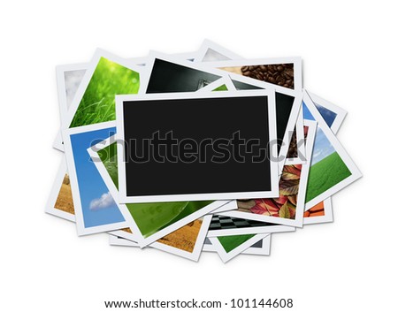 Stack of instant photographs isolated on white background with clipping path for the inside of blank one