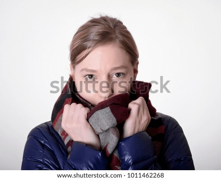 young blond woman freezing