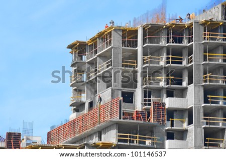 Building construction site against blue sky Royalty-Free Stock Photo #101146537