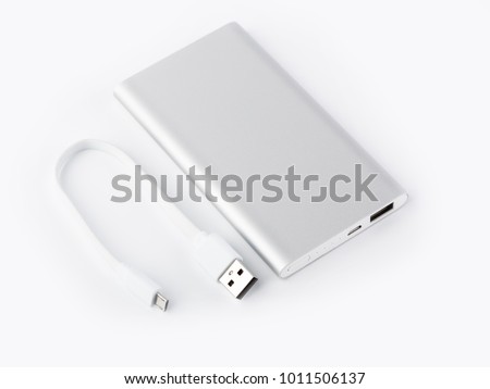 Power bank for charging mobile devices. White smart phone charger with power bank. battery bank. External battery for mobile devices. Royalty-Free Stock Photo #1011506137