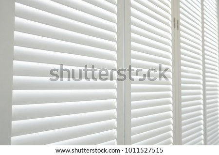 White wooden shutters, White wooden blind. Royalty-Free Stock Photo #1011527515