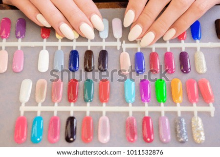 Manicurist collecting colorful nail palette