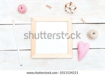 Wooden frame and art detail. Flat lay