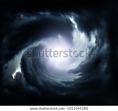 Blurred Swirl in the Dark Storm Clouds with Ray of the Light