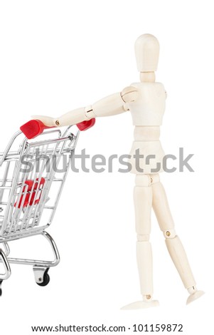 Shopping concept. Wooden dummy and metal shopping cart on a white background