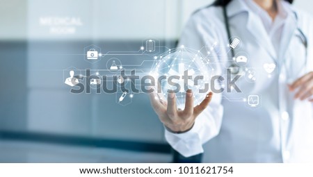 Technology Innovation and medicine concept. Doctor and medical network connection with modern virtual screen interfacein in hand on hospital background
