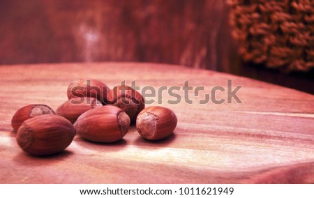 Hazelnuts on a wooden surface