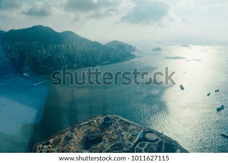 Amazing aerial view of the Hong Kong bay with many ships and tankers.