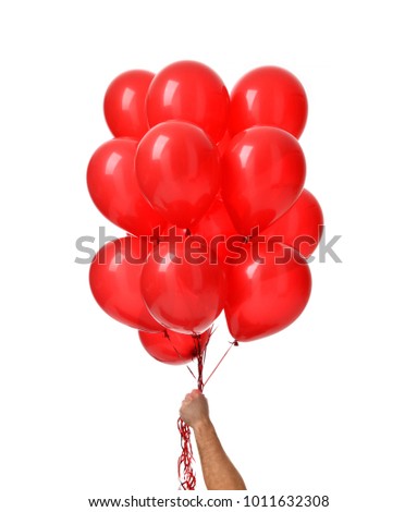  Man hand hold bunch of big red balloons object for birthday party isolated on a white background