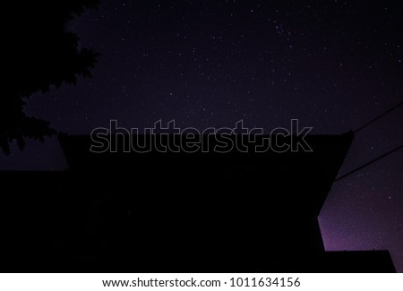 Dark silhouette under the starry sky.