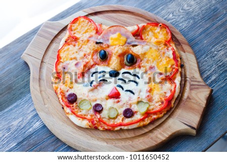 children's funny pizza in the form of a cat's face - Italian cuisine, children's menu