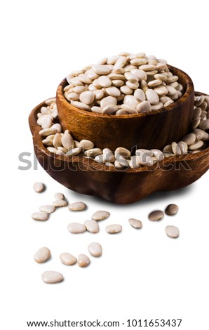 Large white dry beans in a bowl on a white background. Selective focus.