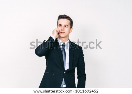 Youn attractive man is talking on the phone, Business concept, copy space