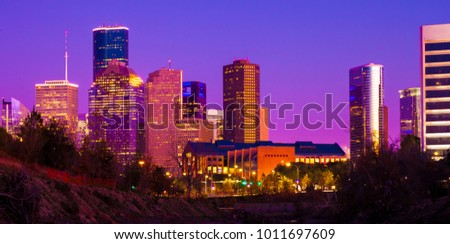 Houston skyline during sunset with neon color lights  illuminated skyscrapers